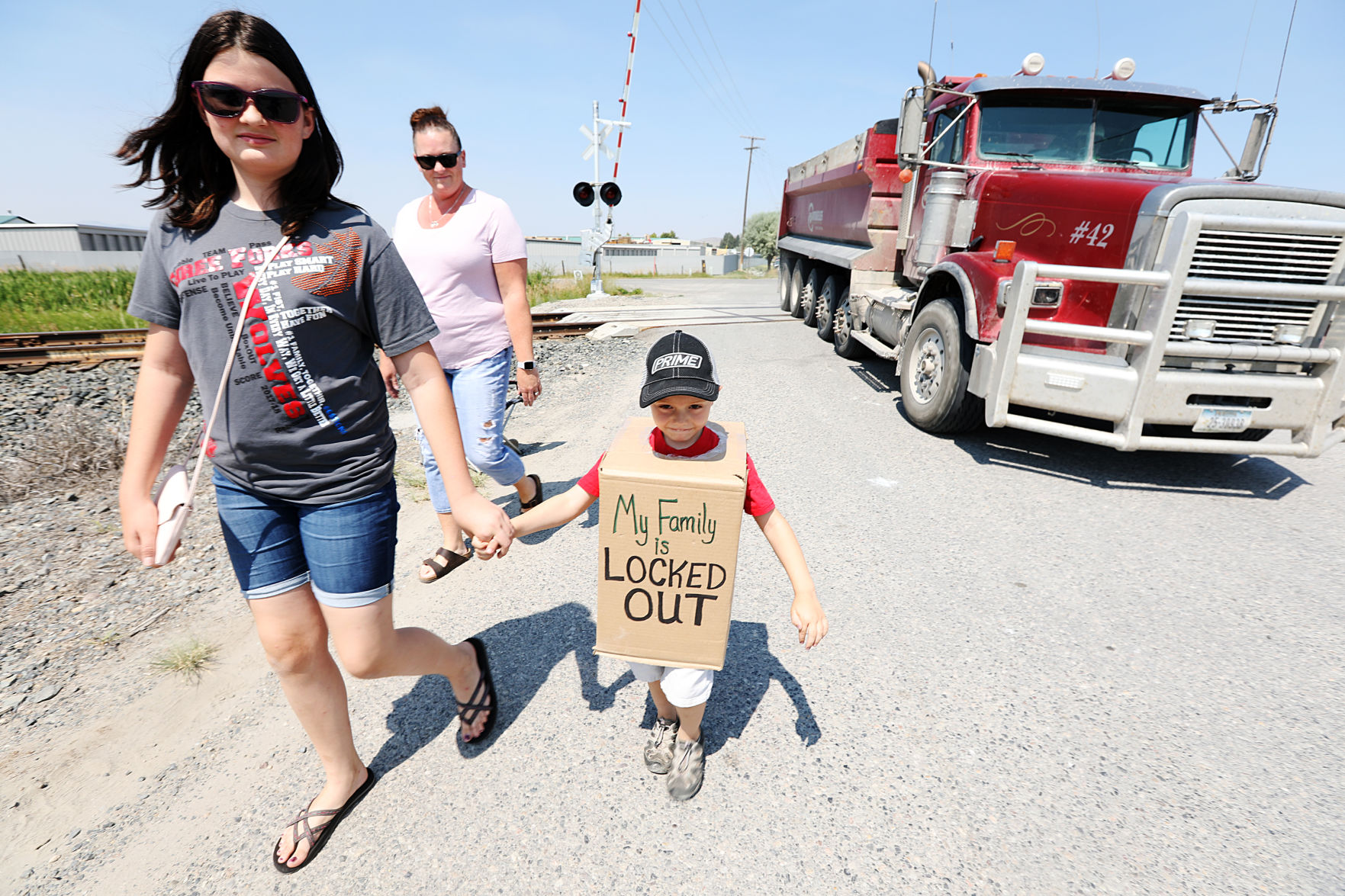 Workers and family members head to the picket line